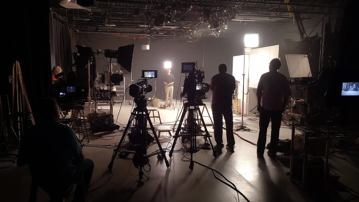 Behind-the-scenes technical setup showing multiple cameras